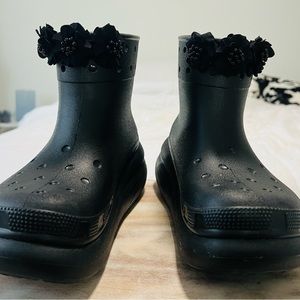 Black ankle height CROC bootie with floral jibbitzs.Very good condition.Worn 2X.